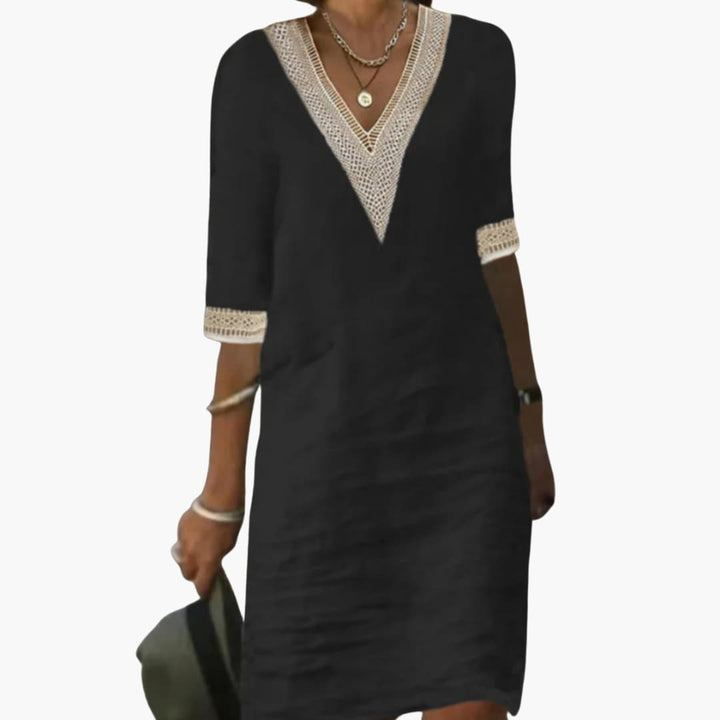 Women’s day dress with V-neckline and three-quarter-length sleeves