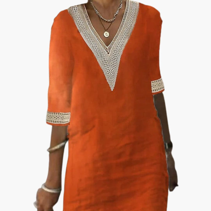 Women’s day dress with V-neckline and three-quarter-length sleeves